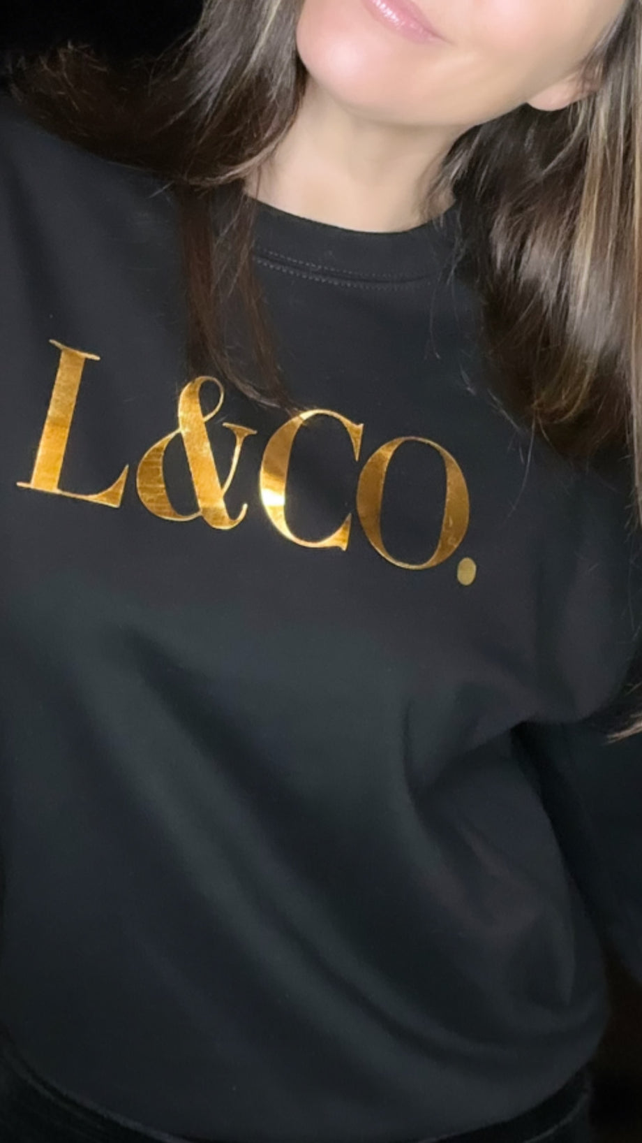 Black sweatshirt with gold writing sale